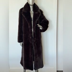L'AGENCE. The fur coat is long (46 inches), brown, very cozy and warm.